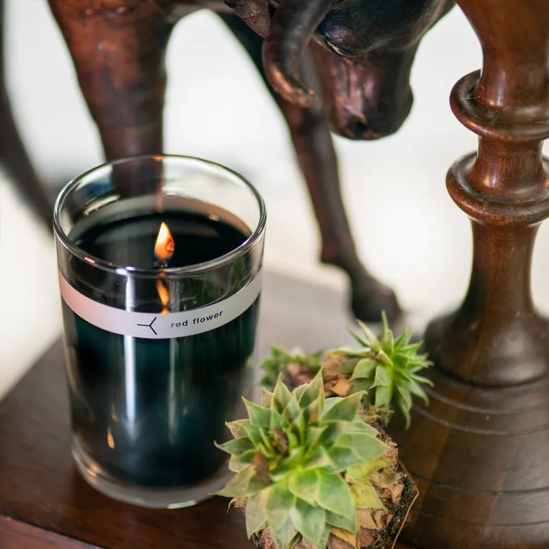 wanderlust petal topped candle - red flower